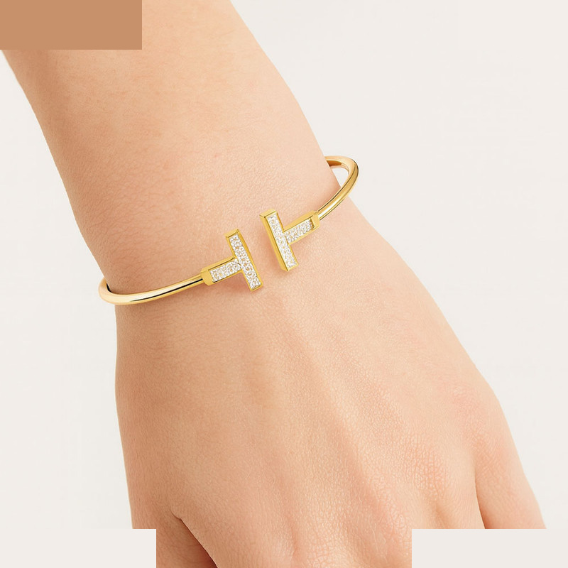 بنگل طلا 18 عیار زنانه ماوی گالری مدل تیفانی نگینی تاینی بنگل طلا 18 عیار زنانه ماوی گالری مدل تیفانی نگینی تاینی