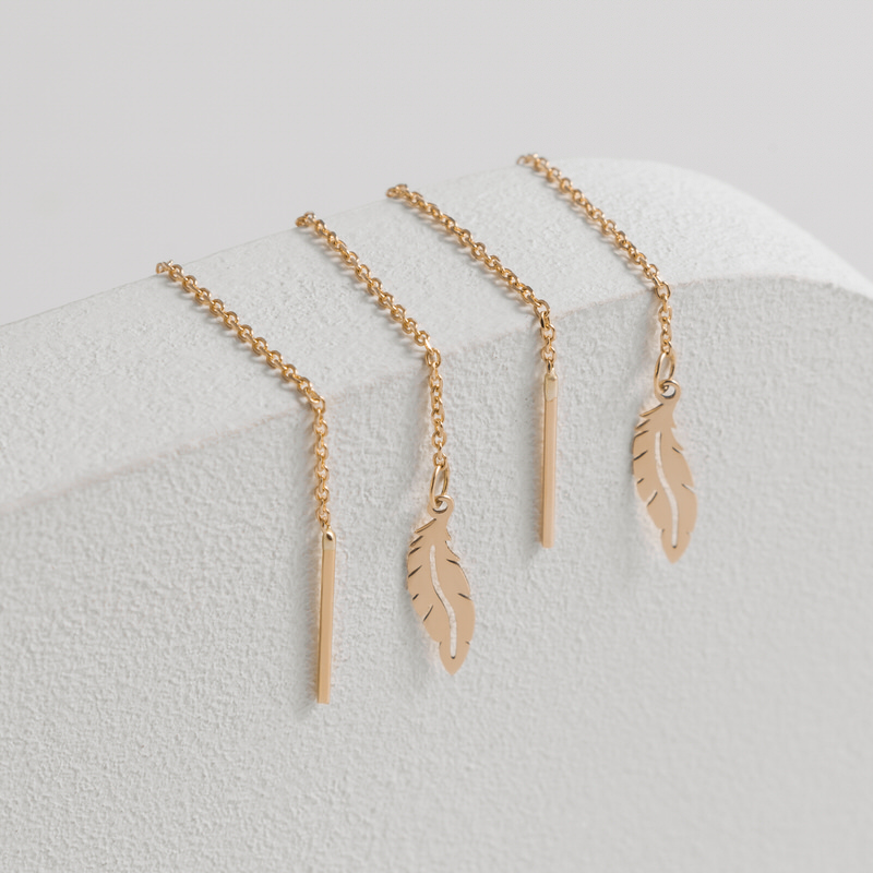 گوشواره بخیه ای طلا 18 عیار طرح پر قو